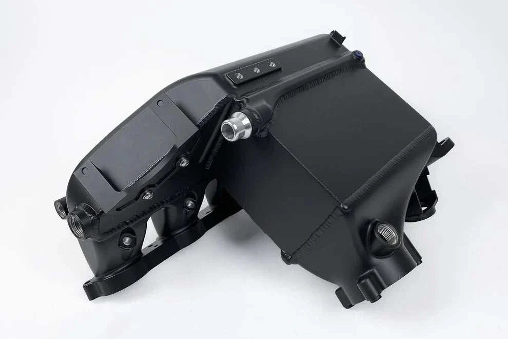 CSF G8X black billet aluminum charge air cooler manifold for BMW S58 engines with enhanced cooling and durability.